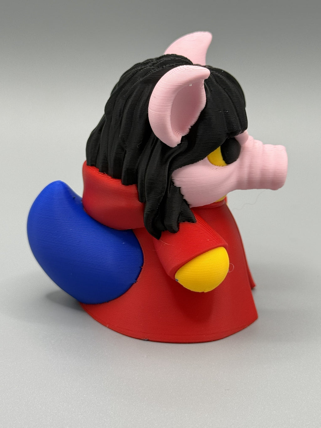 Pig Mask Duck side view showing red robe detail