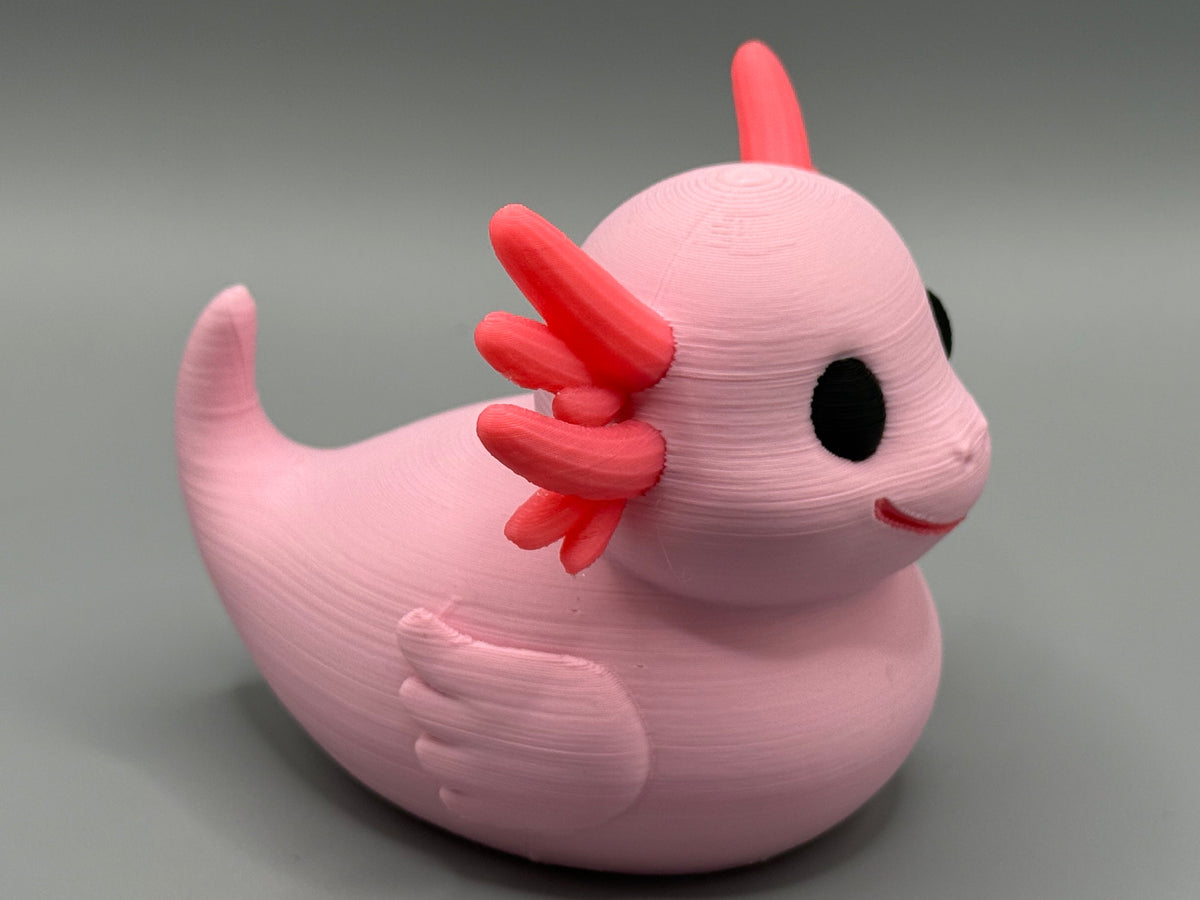 Axolotl Duck – side view showing pink body and feathery gill frond detail