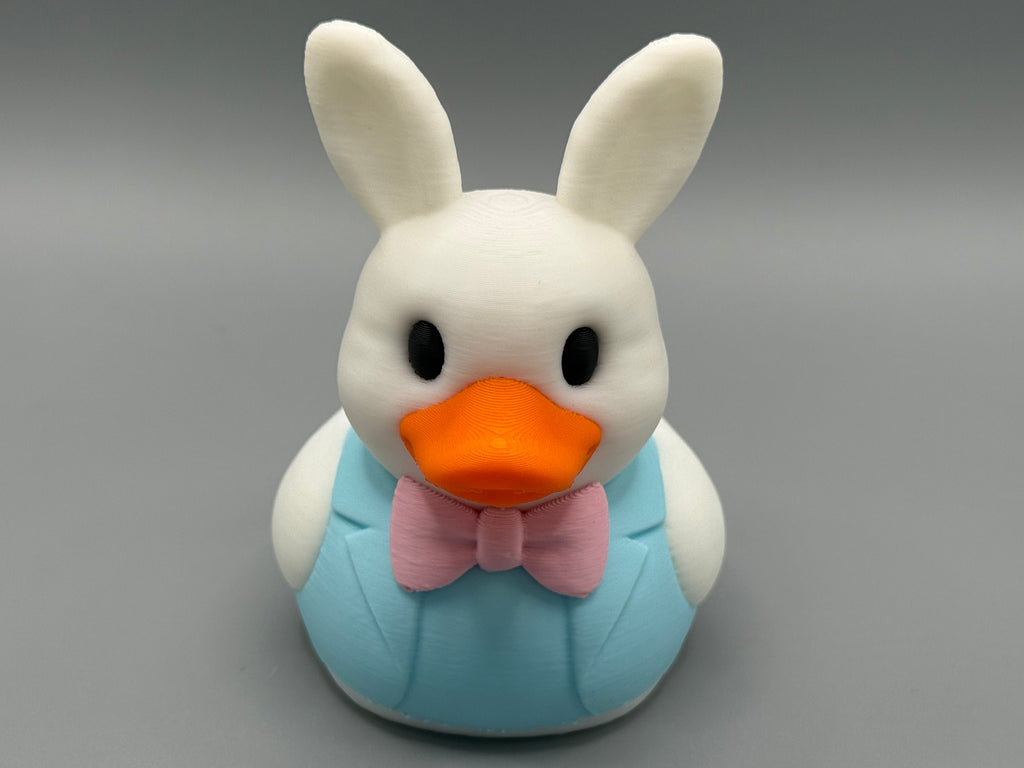 Easter Bunny Duck – side view showing bunny ear detail and blue suit