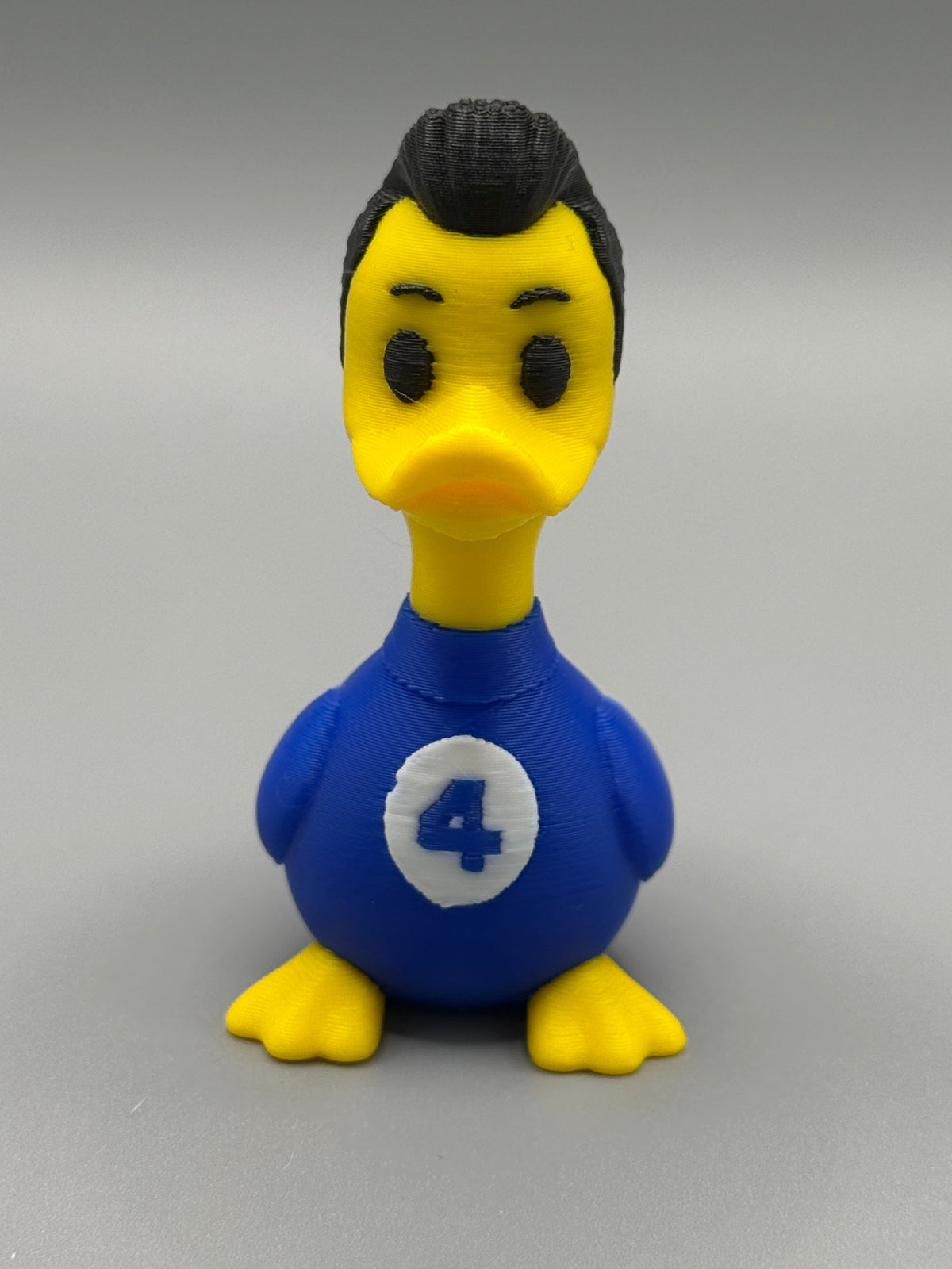 Fantastic 4 Mr. Fantastic Duck – front view showing blue suit with #4 emblem and dark swept-back hair