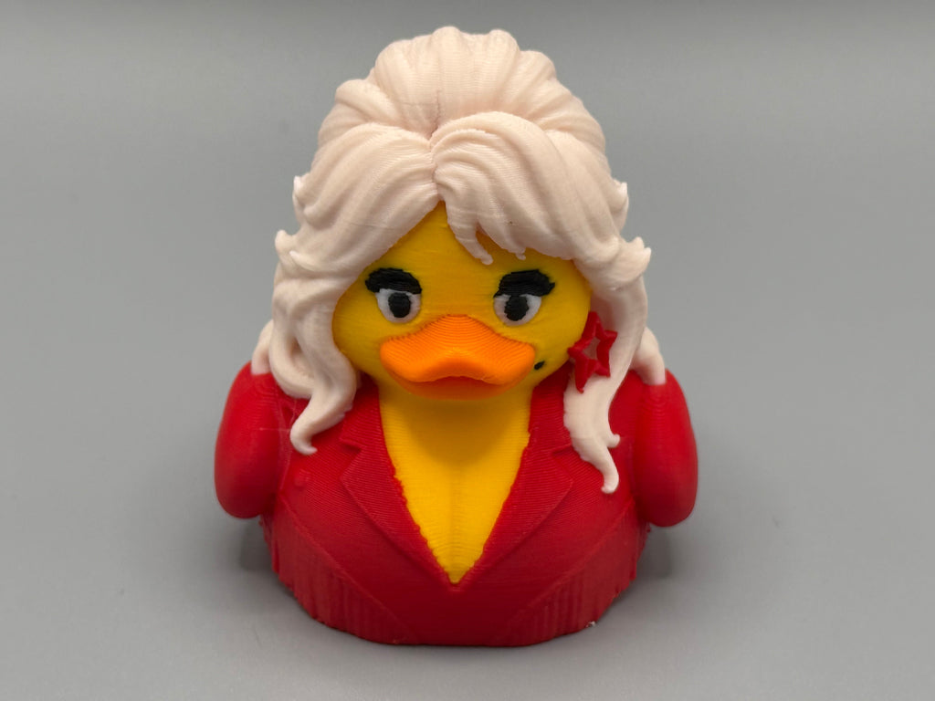 Dolly Parton Duck – front view showing iconic blonde hair and red outfit