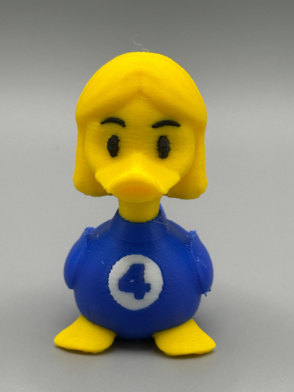 Fantastic 4 Invisible Woman Duck – front view showing blue suit with #4 emblem and blonde hair